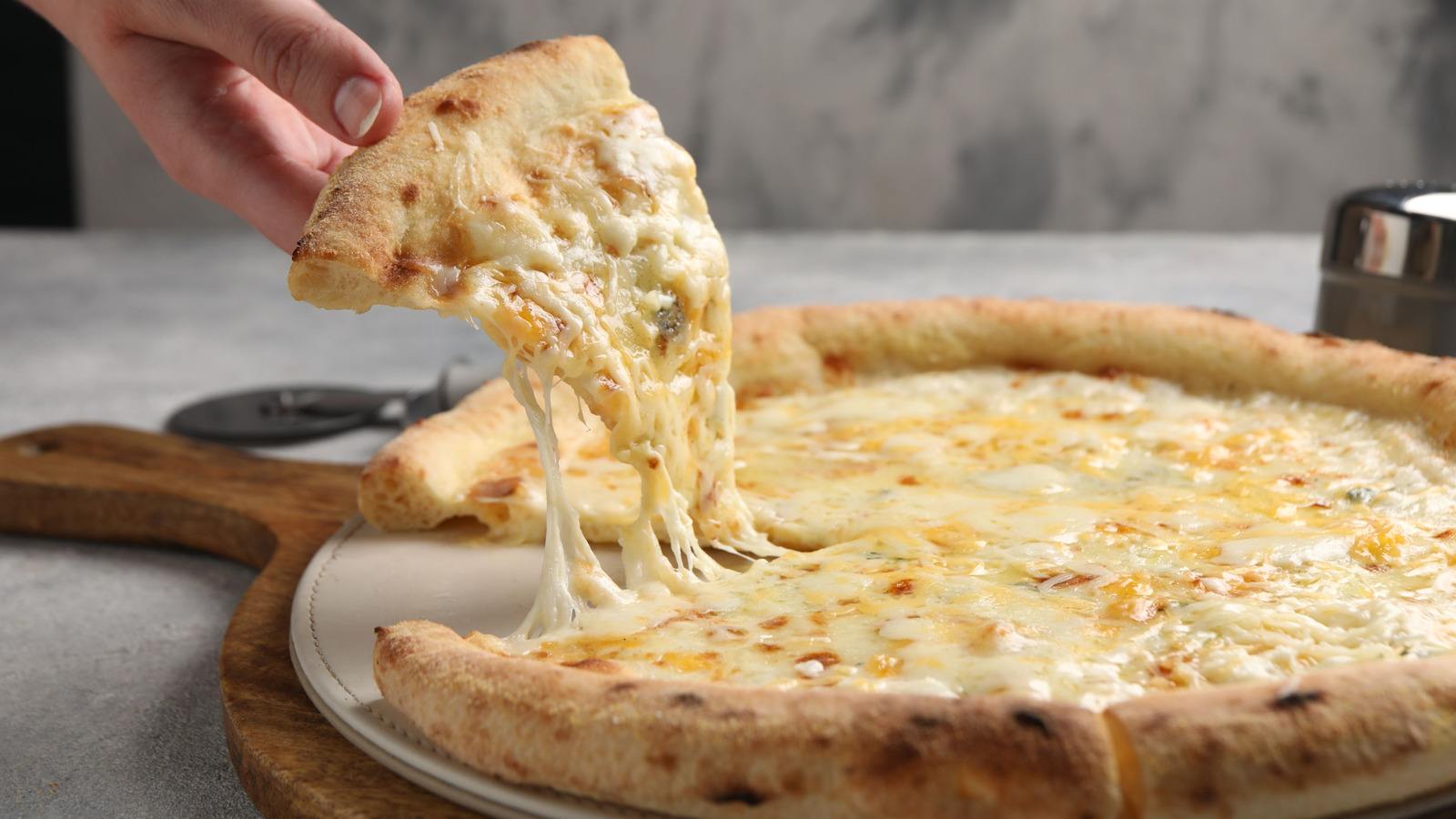10 Underrated Cheeses You Should Consider For Your Pizza - Tasting Table