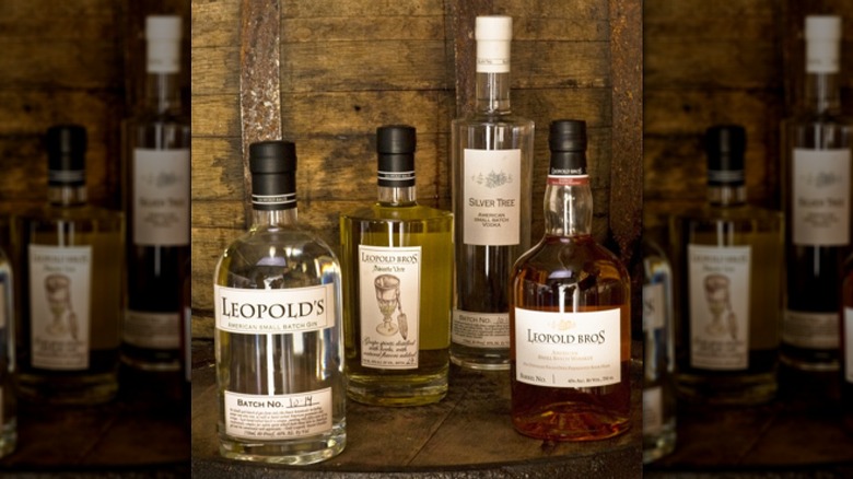 An assortment of Leopold Bros. spirits, with Small Batch Gin front left.