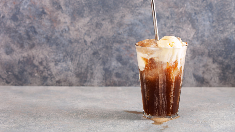 Coke float in glass with straw
