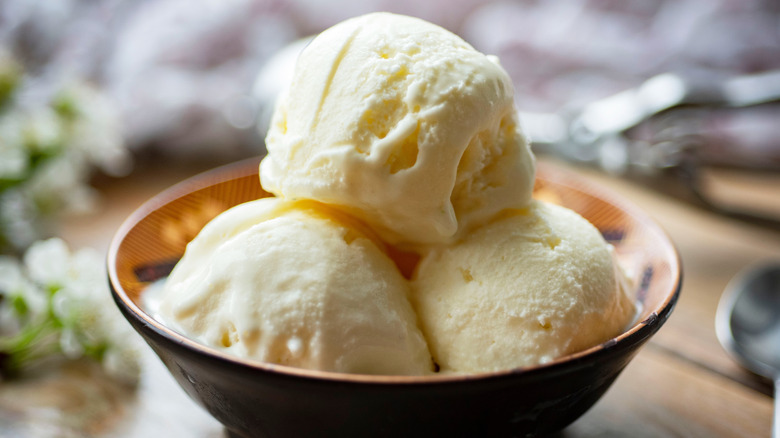 ice cream in a bowl on a wooden table