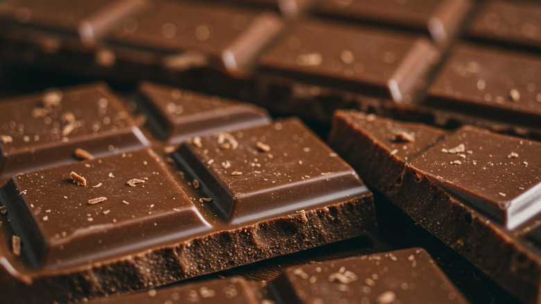 Close up of broken bars of dark chocolate