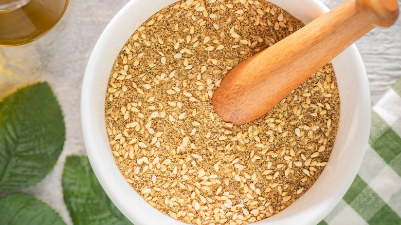 Dukkah in a white bowl on a table