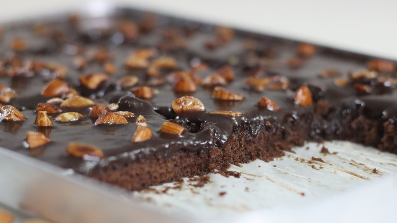 Texas sheet pie in a baking sheet, topped with chopped almonds