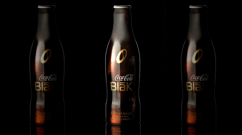 Coca-Cola Blāk bottle on a black background