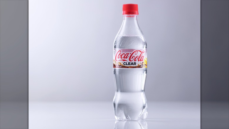 Bottle of Coca-Cola Clear on a grey background