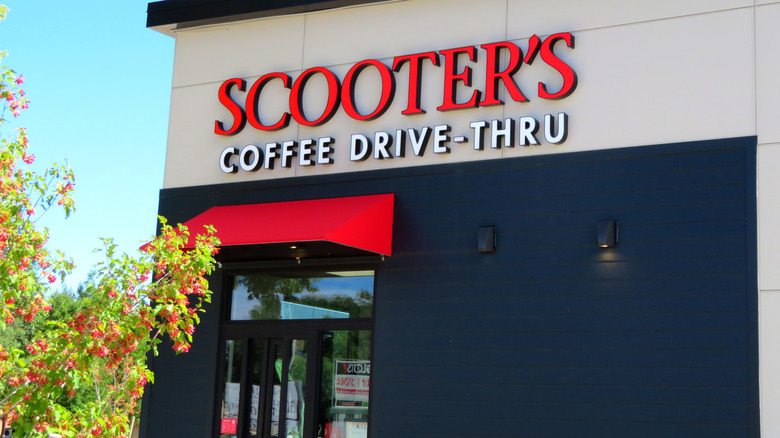 The exterior of a Scooter's Coffee drive-thru on a sunny day