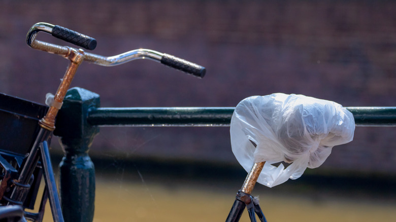 Bike seat covered with plastic bag