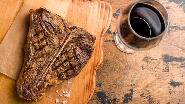 porterhouse steak with red wine glass