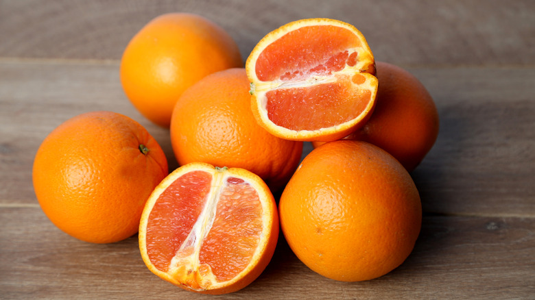 cara cara oranges on a wooden table