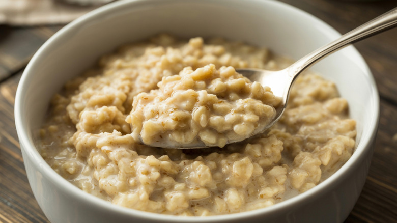 Porridge in a white bowl with a spoon