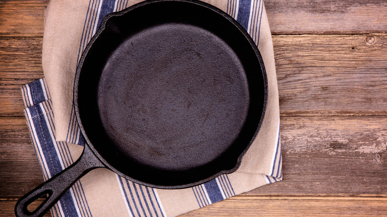 a cast iron skillet on a wood table