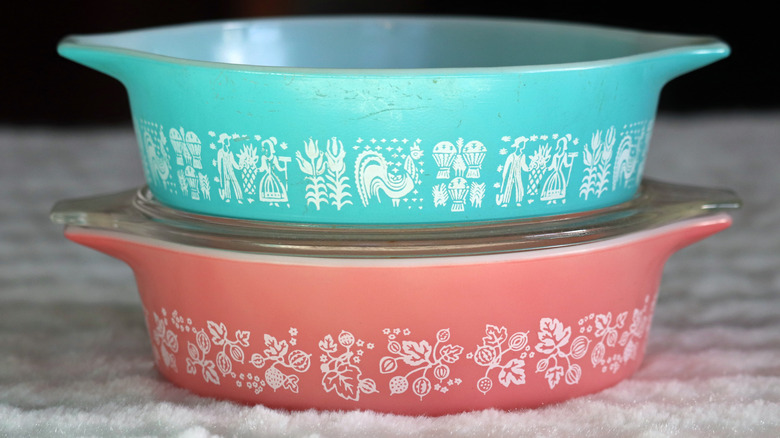 two color pyrex dishes with designs