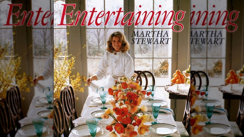Cover of Stewart's book 'Entertaining', featuring her setting a grand table