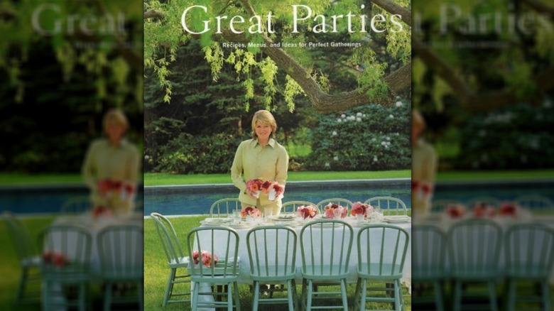 Cover of 'Great Parties' featuring Stewart setting flower centerpieces on a large, outdoor dining table.