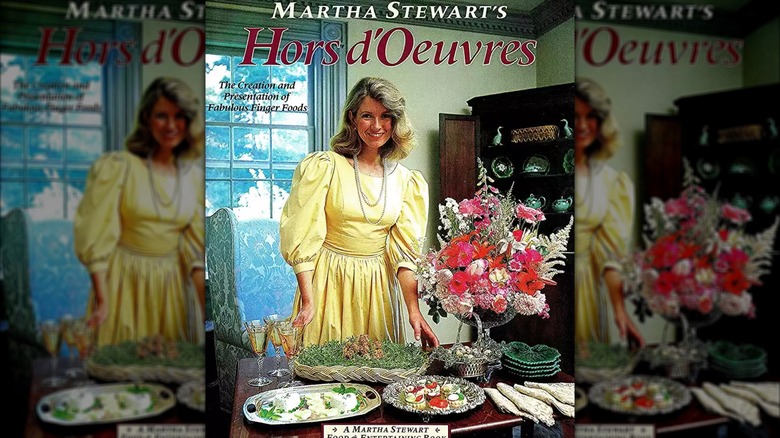 Cover of Stewart's book 'Hors d'Oeuvres', featuring her setting a grand table