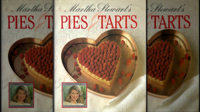 Cover of Stewart's book 'Pies & Tarts', featuring a hearts-shaped, fresh wild strawberry tart on the cover.