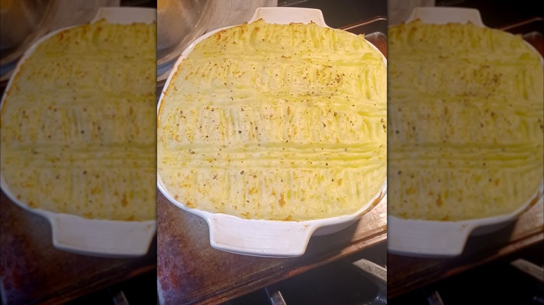 Potato pie in a white oven dish