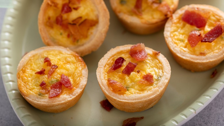 Mini bacon quiches on serving platter