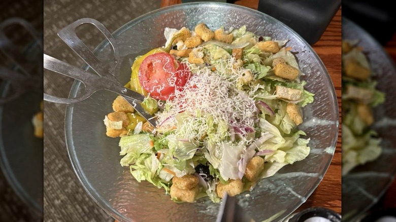 House salad at Olive Garden in a glass bowl