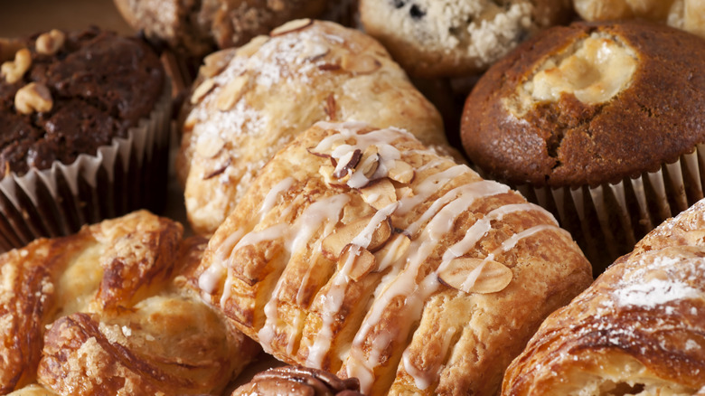 closeup image of assorted bread loaves and muffins