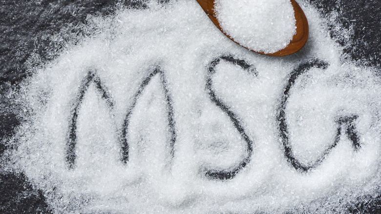 Some MSG on a dark surface with an outline of the letters MSG