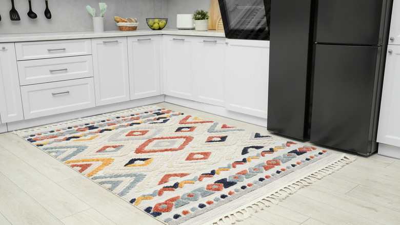 Colorful rag placed on kitchen floor