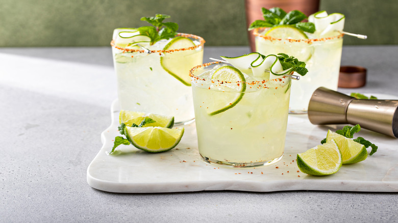 Three spicy margaritas on a white counter
