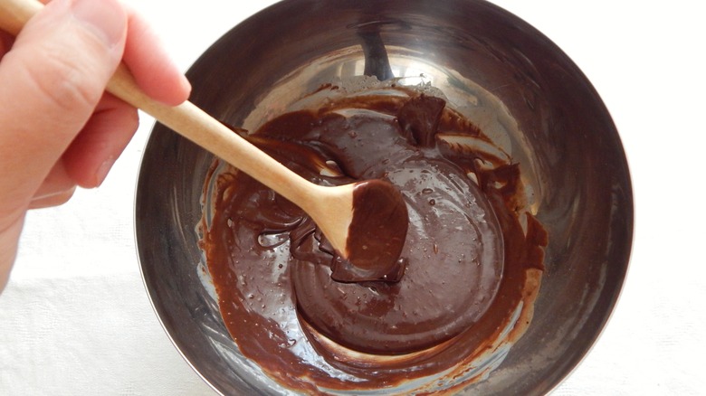 Mixing bowl of melted chocolate and fudge ingredients