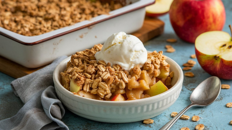 Apple crisp with cranberries topped with ice cream