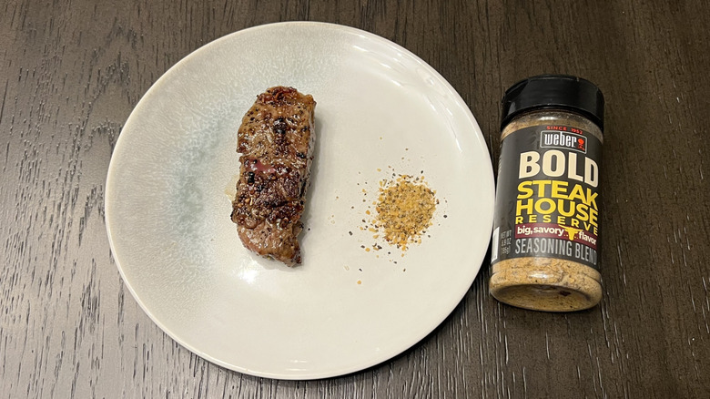 Weber Bold Steakhouse Reserve seasoning blend on steak.