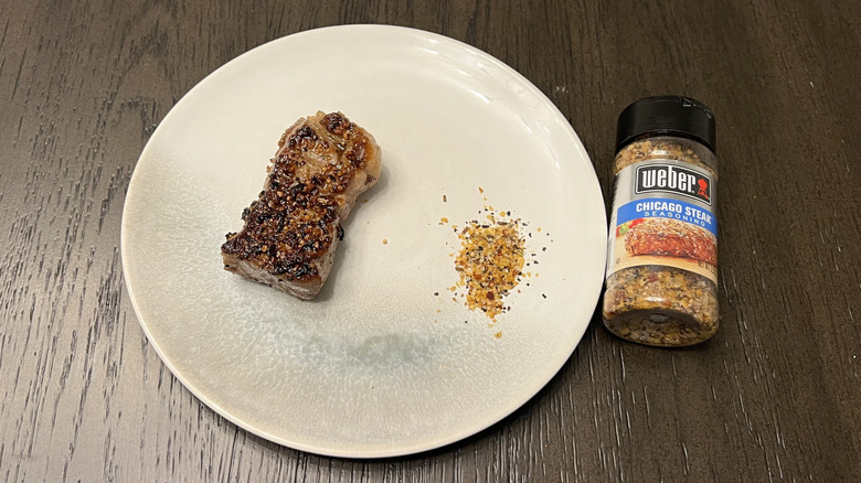 Weber Chicago steak seasoning on steak.