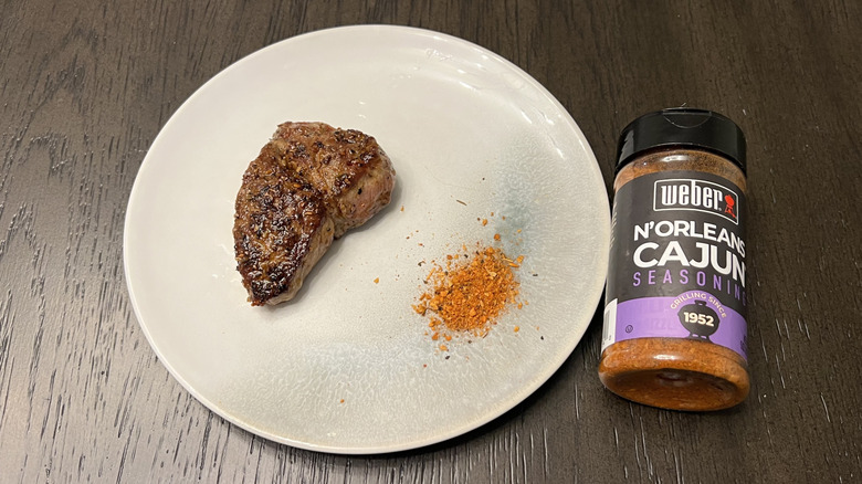 Weber N'Orleans Cajun Seasoning on steak.