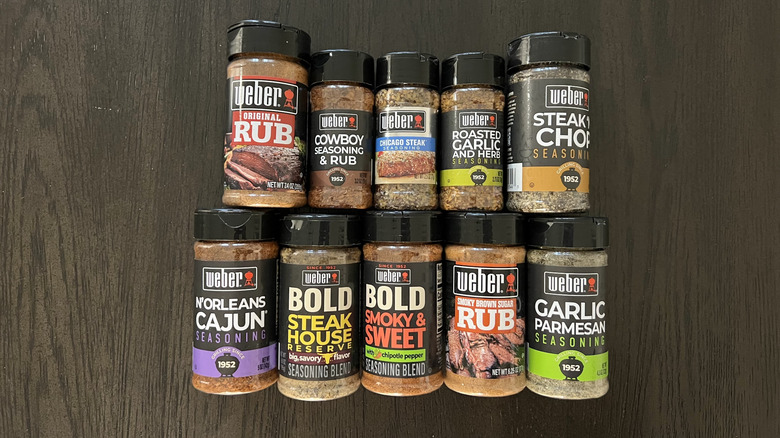 10 different Weber steak seasonings in plastic jars.