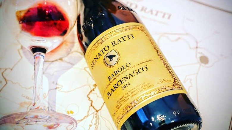bottle of red Ratti Barolo DOCG Marcenasco wine with glass