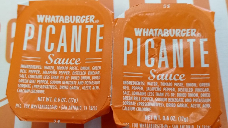 Two packets of picante sauce from Whataburger