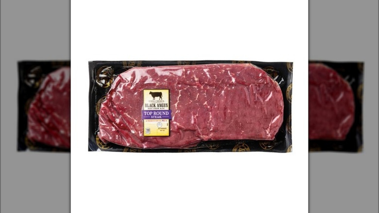 Plastic package of Black Angus Choice Top Round Steak from Aldi