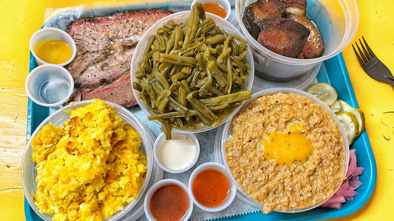 A platter of barbecue from City Limits, featuring brisket and many sides