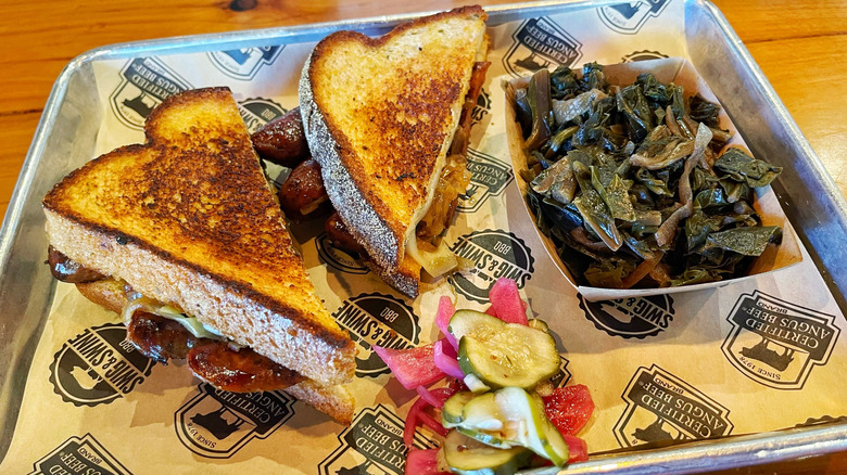 The sandwich special from Swig & Swine with a side of collards