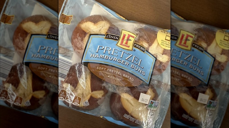 L'oven Fresh pretzel hamburger buns package with a wooden background