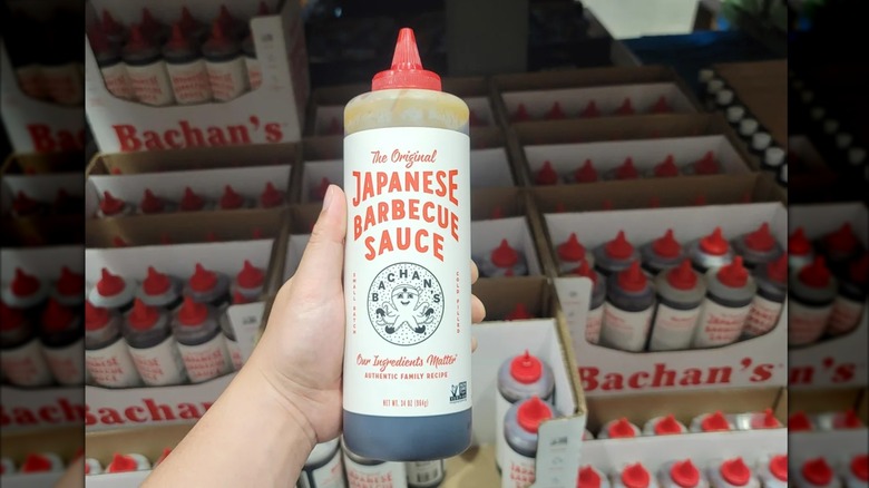 Person holding bottle of Bachan's Japanese Barbecue Sauce