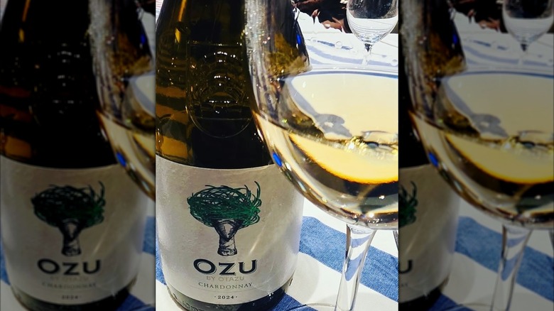 closeup bottle and glass of white wine