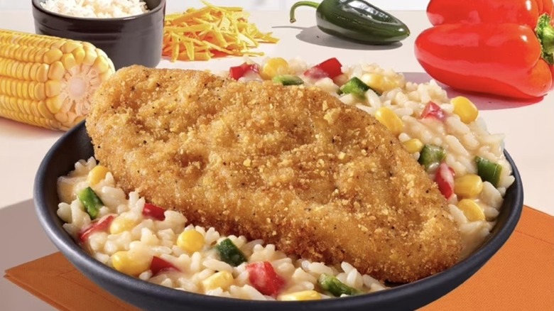 Bowl with Lean Cuisine crusted fish on bed of rice with ingredients in the background