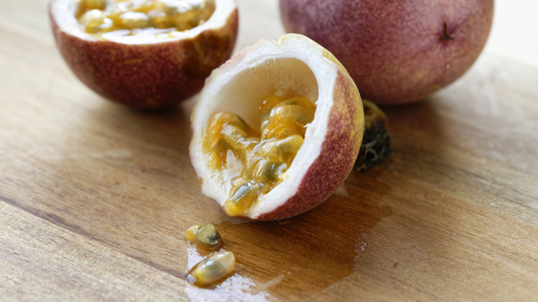 Fresh passionfruit cut open and whole