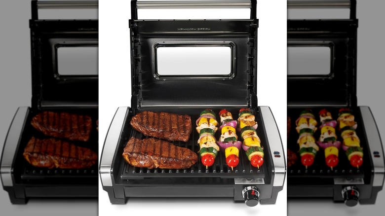 Hamilton Beach electric indoor searing grill with steaks and kabobs grilling