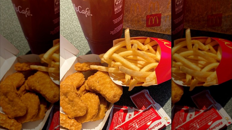 A 10-piece McNugget meal with fries and a drink that looks like iced tea