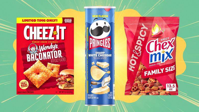 Blue can of Pringles between red packages of Cheez-It and Chex Mix, on a yellow and green background