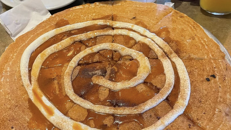 Big cinnamon roll pancake with glaze swirl