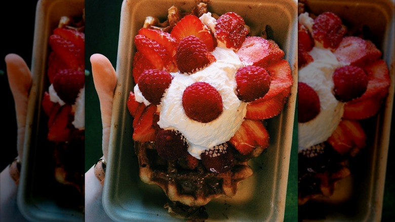 Belgian waffle with whipped cream and red fruit