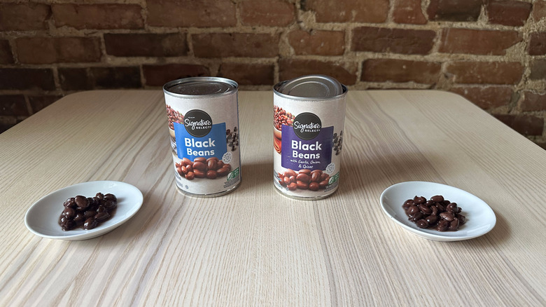 Signature Select black beans on two small white plates