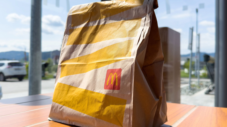 McDonald's takeout bag on table outside
